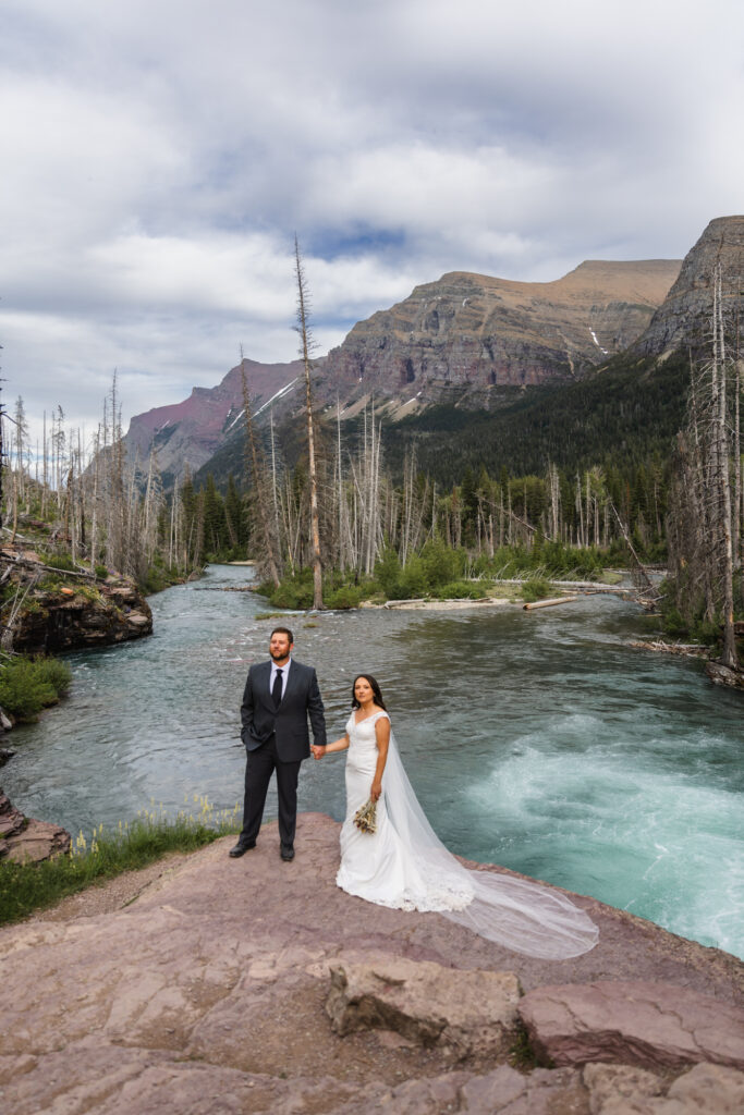 couple holding hand in Glacier National Park